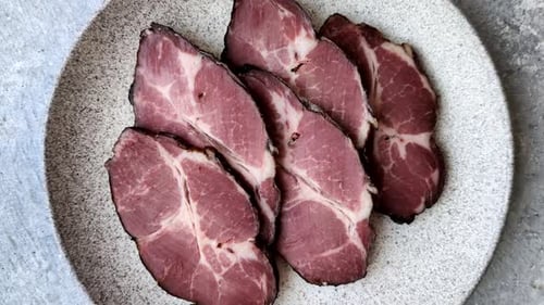 Meat, smoked ham, or pork sausage sliced for breakfast sandwiches. Sliced ham