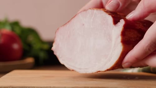 Close Up of Hands Placing Meat on Cutting Board
