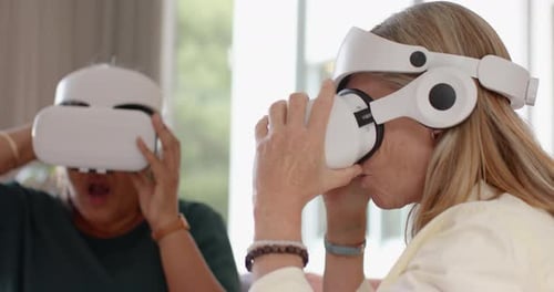 Women Enjoying Virtual Reality Headsets at Home
