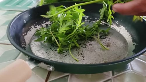 close up of hands cutting vegetables.
