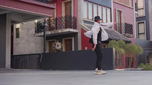 Young Breakdancer Performing Acrobatic Moves on Urban Rooftop