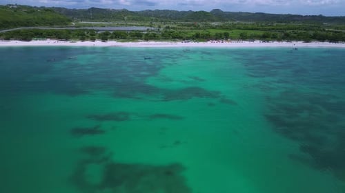 Picturesque Curved Bay With White Sands And Surrounding Rural Landscape