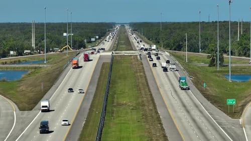 Aerial View of American Freeway with Many Driving Cars During Rush Hour in Florida View From Above
