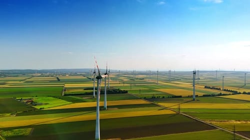 Modern wind farm in the picturesque countryside. Multiple wind turbines produce clean energy.