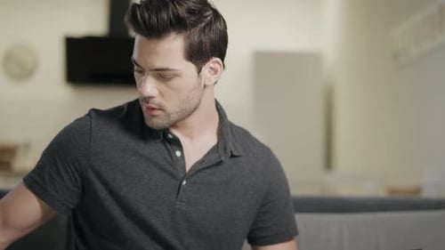 Man Reviews Data at Home