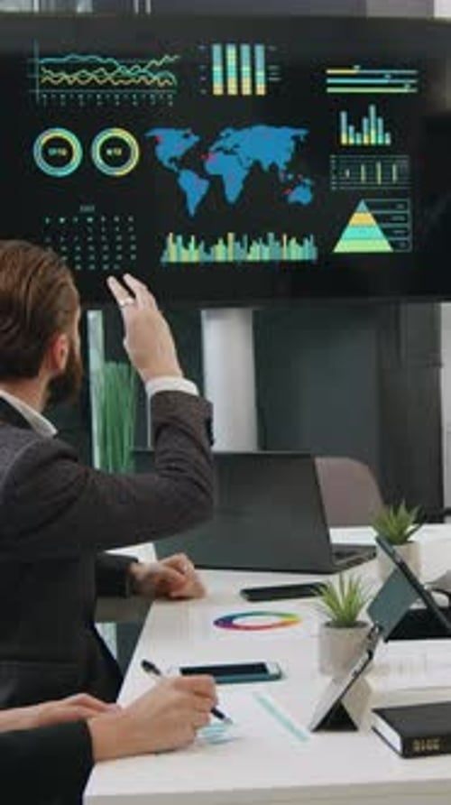 Business Team at Board Meeting Discussing Data