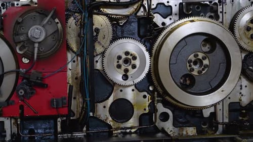 A Fragment of the Engine Engine Gears Wheels Closeup View