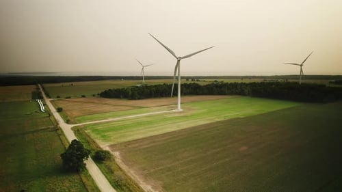 Drone footage of a wind turbine generating energy from wind