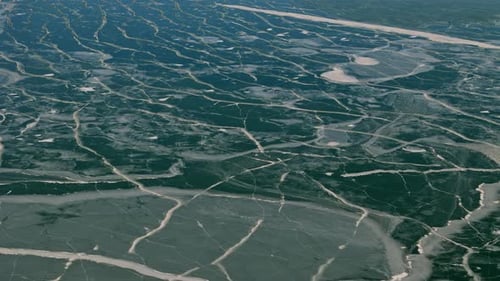 Drone View of Water Surface During Extreme Winter Cold Subzero Temperatures Create Floating Ice