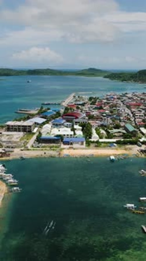Colorful Houses Along Coast with Blue Sea Siargao Philippines