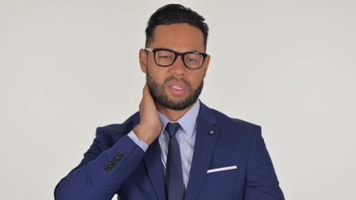 Man in Suit Massaging Neck, White Background