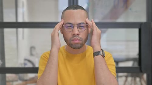 Adult Rubbing Temples to Relieve Headache