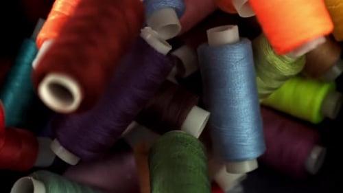 Multicolored Threads Fall on the Table Filmed on a Highspeed Camera at 1000 Fps