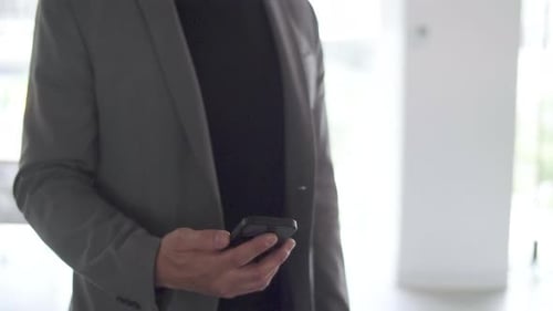 Portrait Businessman Texting with Smart Phone in Office Businessman