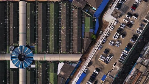 Aerial Top Down Perspective Flying Over Chatuchak Weekend Market in Bangkok Camera Slowly Reveals