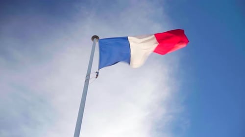French Flag Waving in the Breeze on Sunny Day