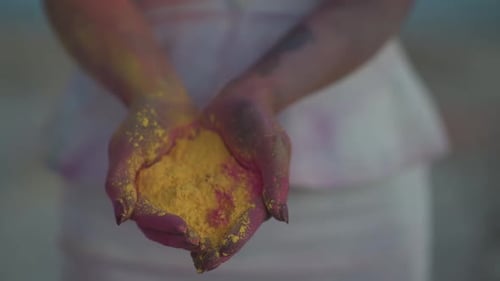 Slow Motion Close Up of Female Hands Full of Colorful Powder for Indian Holi Festival of Spring and