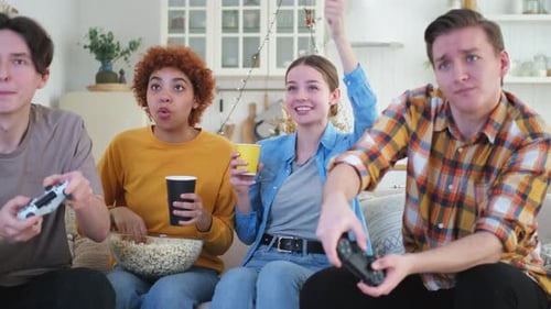Home Party Cheerful Group of Friends Playing Video Games at Home Happy Diverse Group Buddies Having