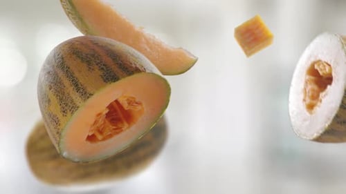 Floating Cantaloupe Slices and Halves on White