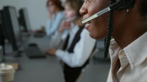 Office Workers Using Headsets in Corporate Environment