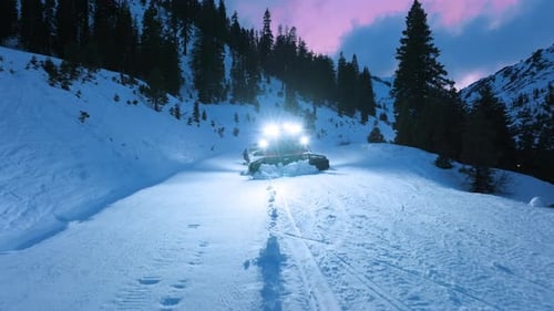 Snowcat Working on Groomed Ski Slope at Winter Resort