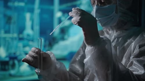 Research and Search Coronavirus Vaccine A Scientist in a Protective Suit Works in a Laboratory