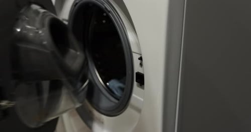 Opening Washing Machine to Remove Clean Laundry