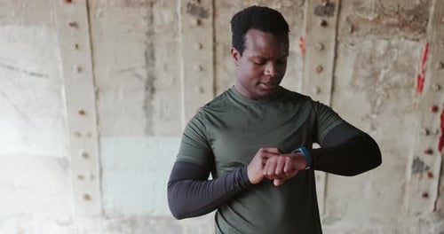 Young Adult Using Smartwatch for Health and Fitness