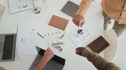 Top View of Diverse Business Team Partners Fist Bumping