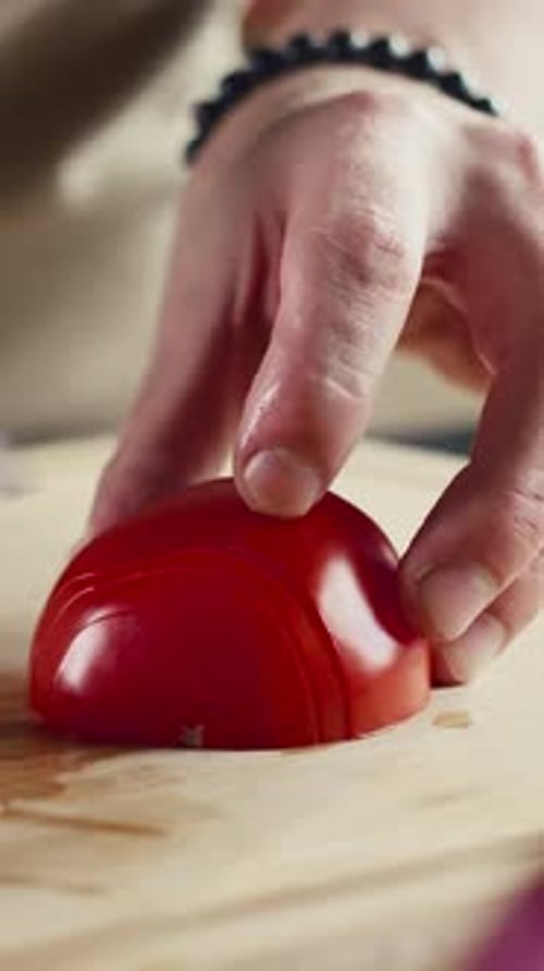 Close Up of Slicing a Fresh Tomato