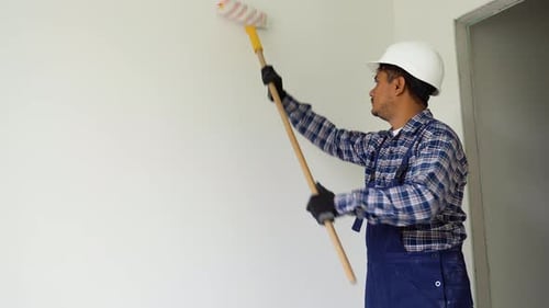 Indian Worker Painting Wall in Room