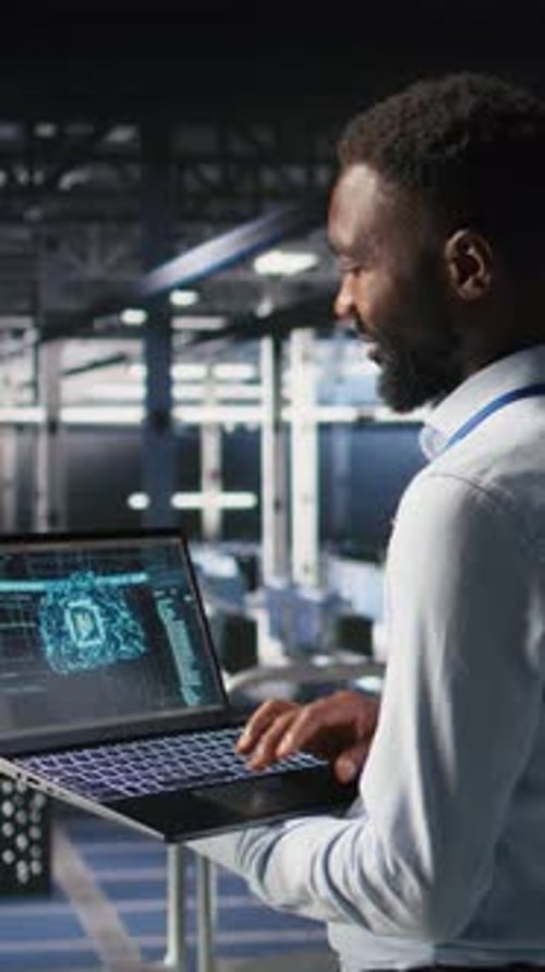 Vertical Video Programmer and Colleague in Data Center Reviewing AI LLM Visualizations