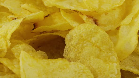 Potato chips rotating close up on culinary parchment., Food Stock ...