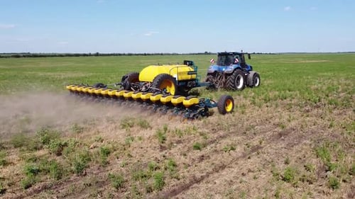 Blue Tractor O.A. Planting Canola On No Till Field