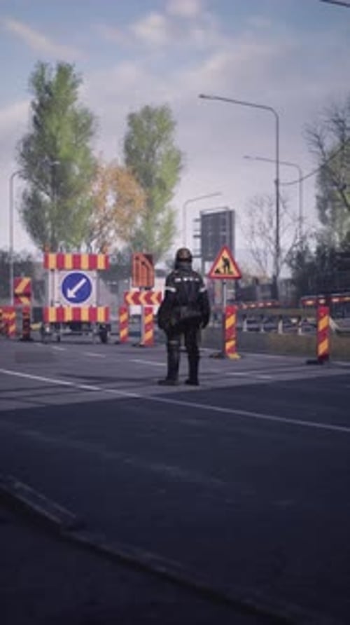 Road Worker Managing Traffic at a Busy Urban Intersection During Daylight