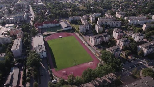 Aerial View of Soccer Field and City Buildings