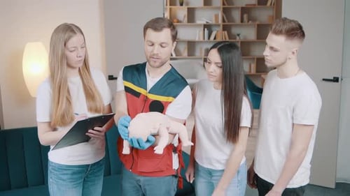 First Aid Instructor Teaches Infant CPR to Students
