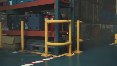 Nighttime View of Empty Warehouse With Shelving Units