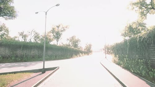 Empty Asphalt Road and Beautiful View of Cityscape on Sunny Day