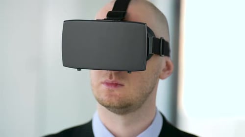 Businessman immersed in augmented reality with vr headset at modern office