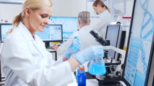 Female Scientist Conducting Experiment in Modern Laboratory