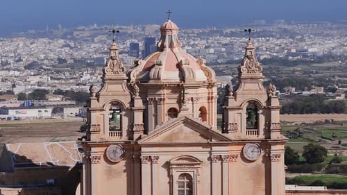 Aerial Pan of St Pauls Cathedral Facade and Dome in Mdina Malta