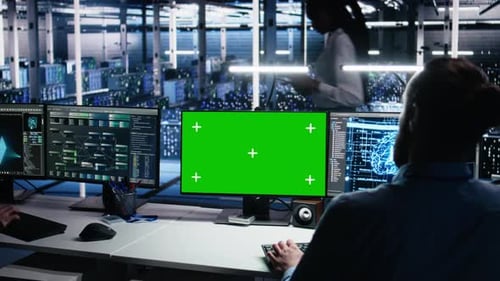 Data Center Engineer Using Green Screen PC to Monitor Neural Network Using AI