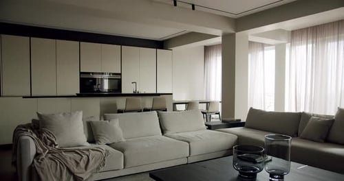 Comfort Sofa Coffee Table and Kitchen Island in Apartment with Modern Interior
