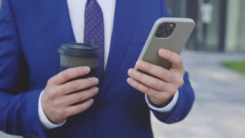 Close Up Of Man Hands Typing Texting Browsing Mobile Phone Holding Coffee Manager Businessman
