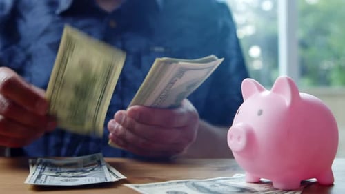 Man Counts Stack Of 100 Dollar Bills In Kitchen In Daylight Close Up Scene