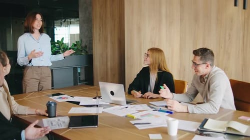 A Team is Gathering in a Contemporary Office Space to Engage in Discussions About Project Strategies