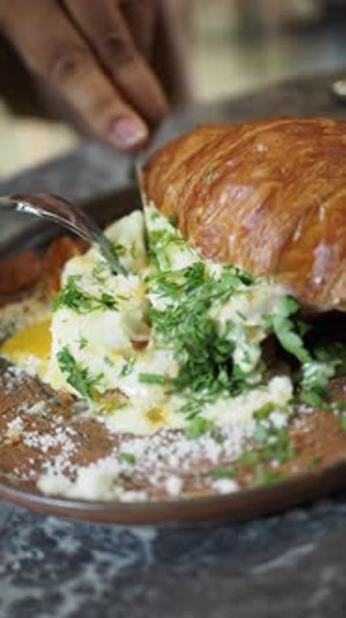 This Croissant Sandwich with Fresh Greens and Cheese Offers a Delightful Taste Experience