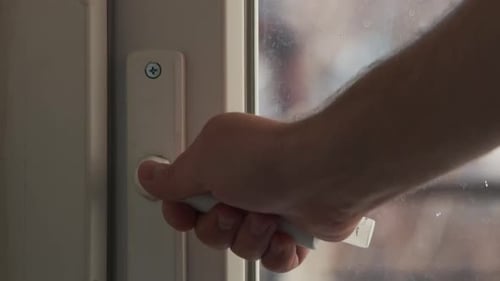 Close Up View of Man Open Balcony Door By Handle