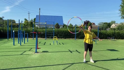 A Female Athlete Works Out at the Sport Area in the Morning